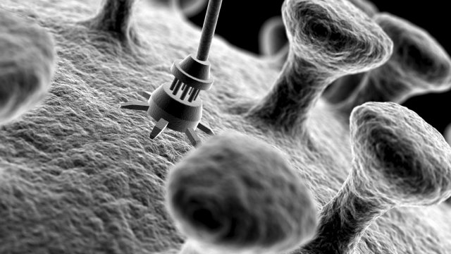 Applicazione di un nano-robot su una cellula tumorale