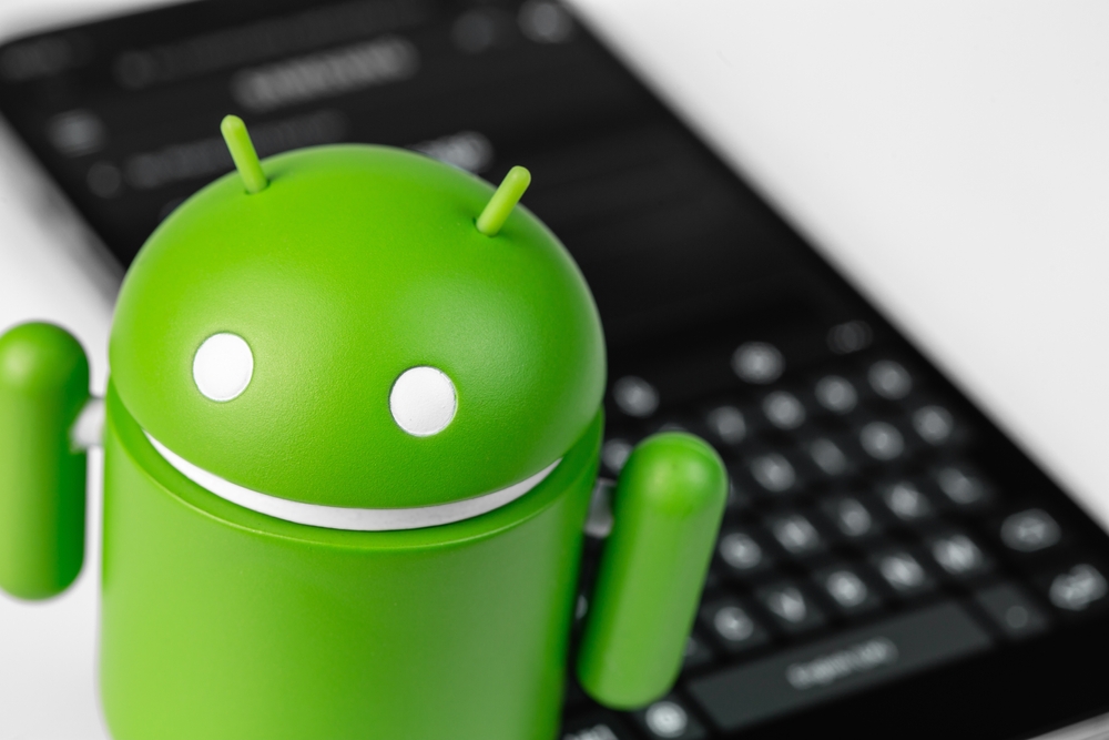 Icona Android con cellulare sullo sfondo Icona Android con cellulare sullo sfondo
