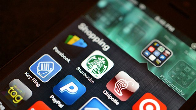 Una schermata di iOS con Passbook e altre app per pagamenti digitali