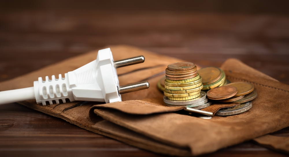 Presa della corrente e denaro Presa della corrente e denaro