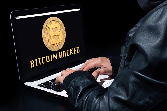 Hacker che ruba Bitcoin